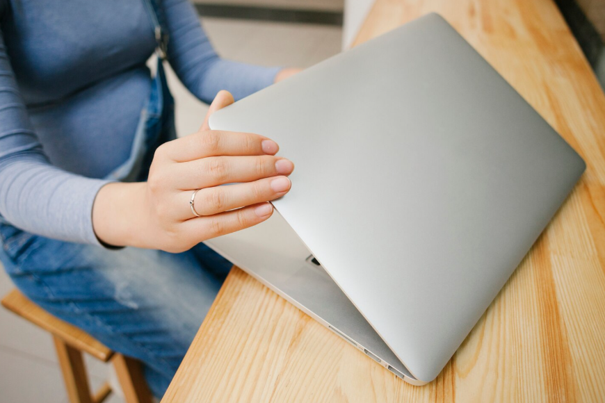 Opt out search trends showing someone closing a laptop at a desk.