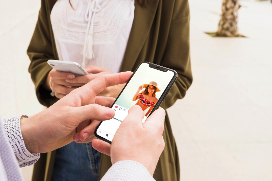 People viewing a dating profile on a smartphone reflecting modern dating search trends.
