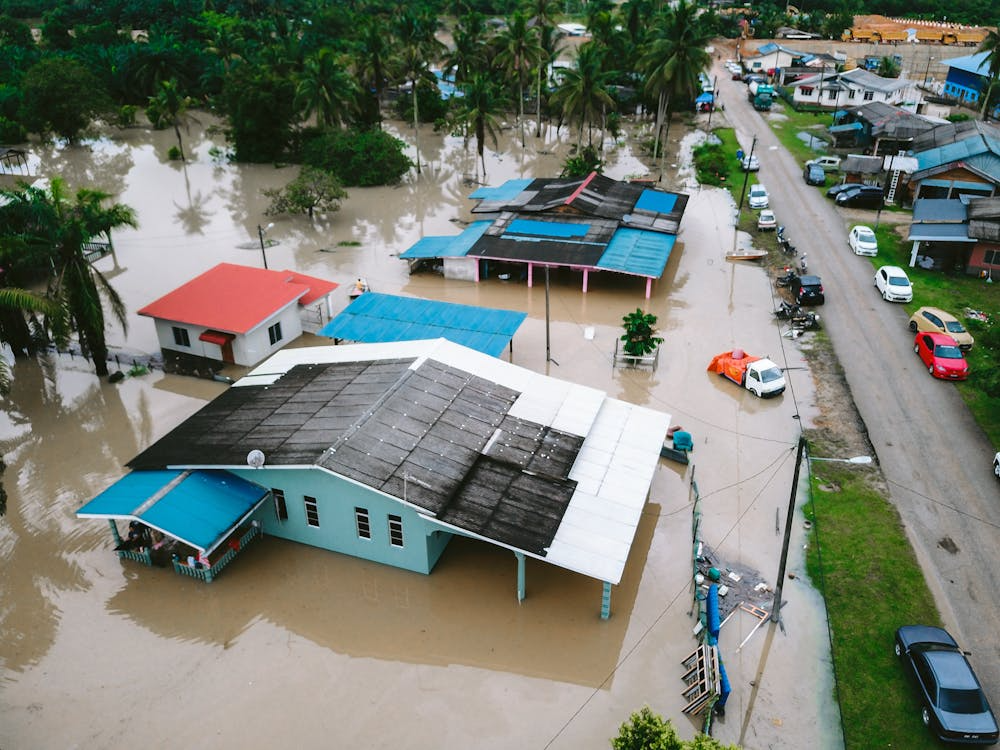 Flooded neighborhood after extreme weather, illustrating weather driven lifestyle searches.