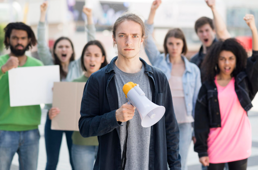 Cultural backlash search trends showing a group protesting with a megaphone.
